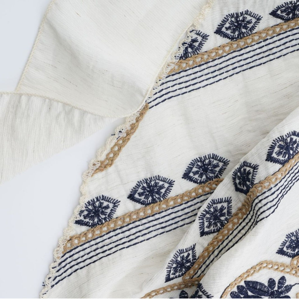 Ivory triangle headscarf with navy geometric embroidery and fabric ties