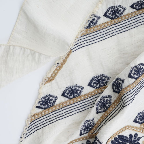 Ivory triangle headscarf with navy geometric embroidery and fabric ties