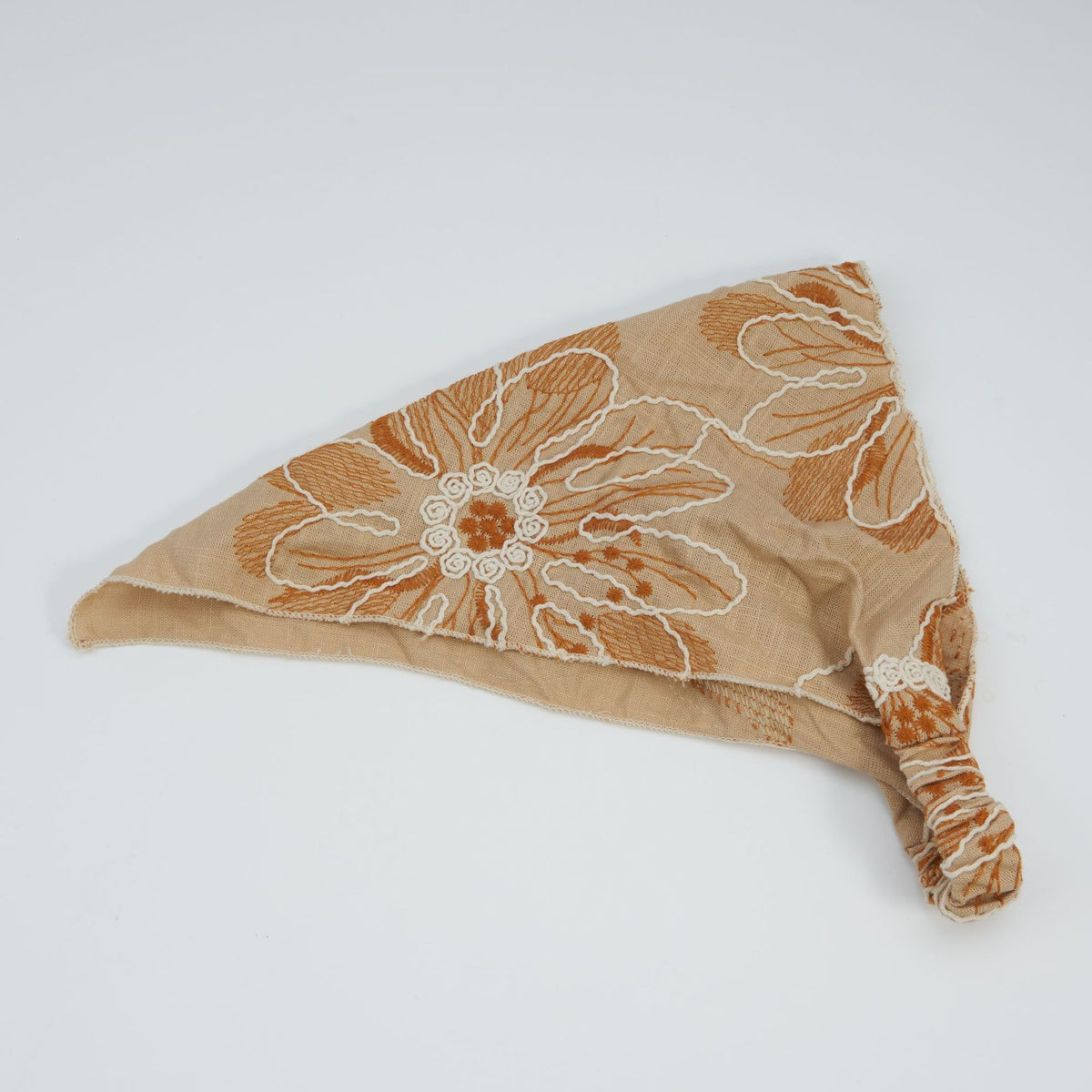Camel triangle headscarf with rust floral embroidery and a gathered elastic back