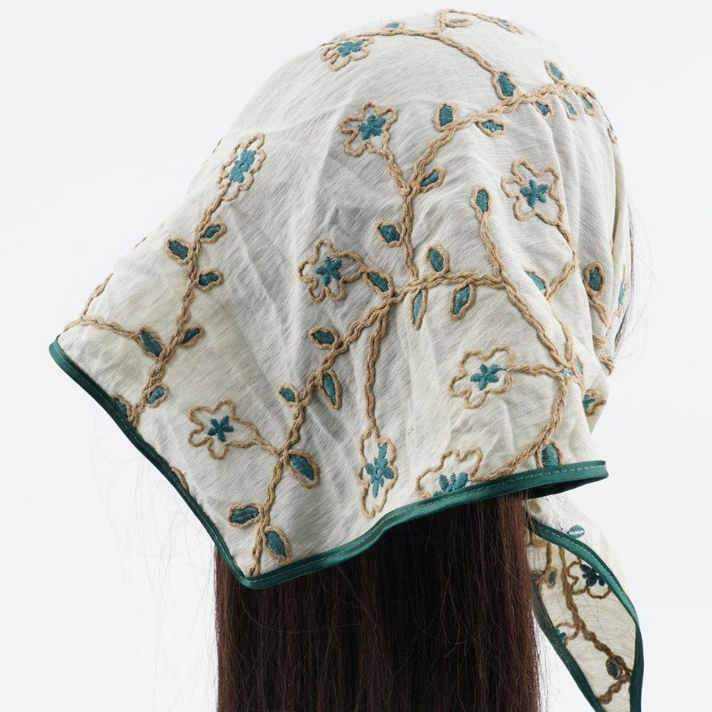 Sage triangle headscarf with teal floral vines and a green satin edge