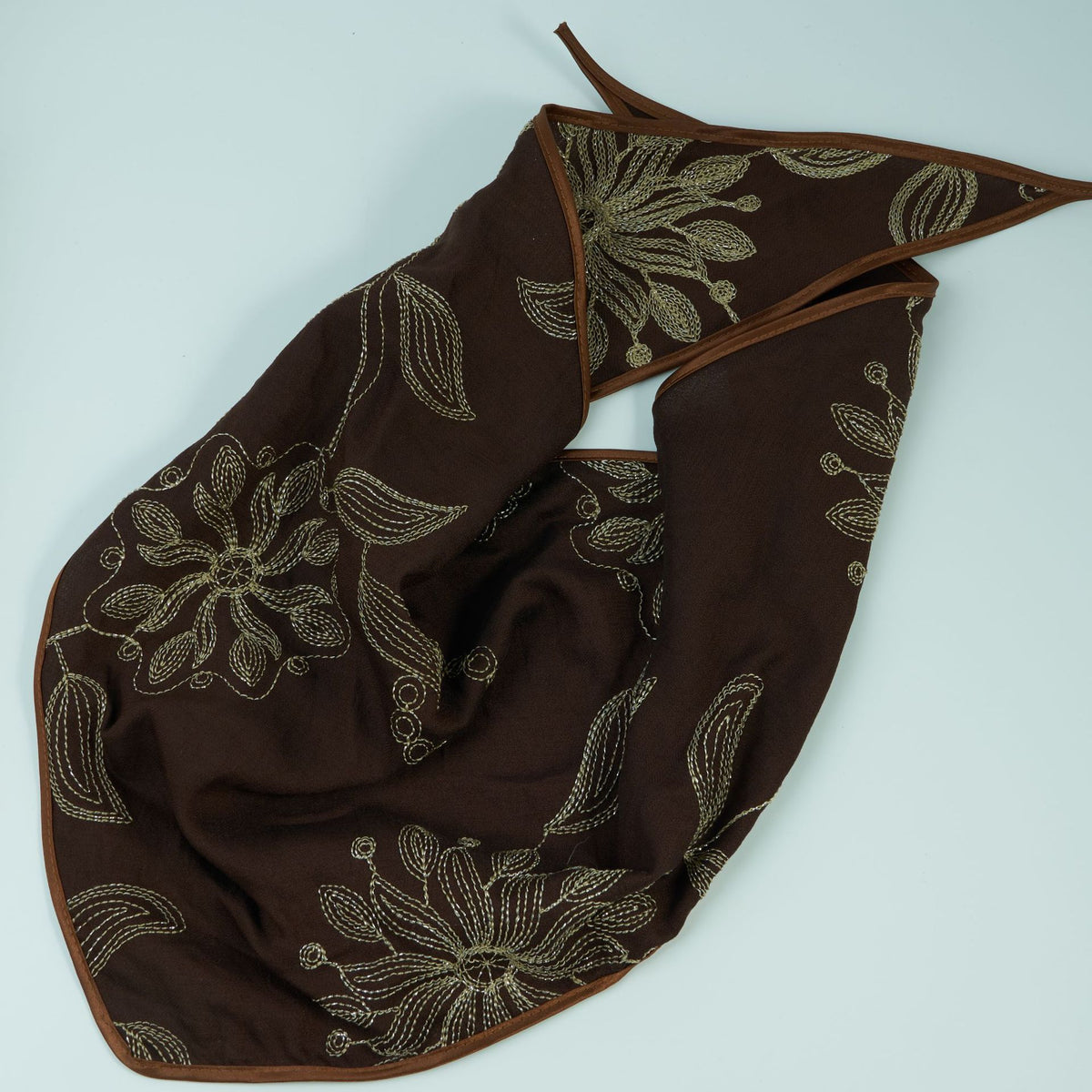 Dark brown triangle headscarf with gold floral embroidery and satin edge