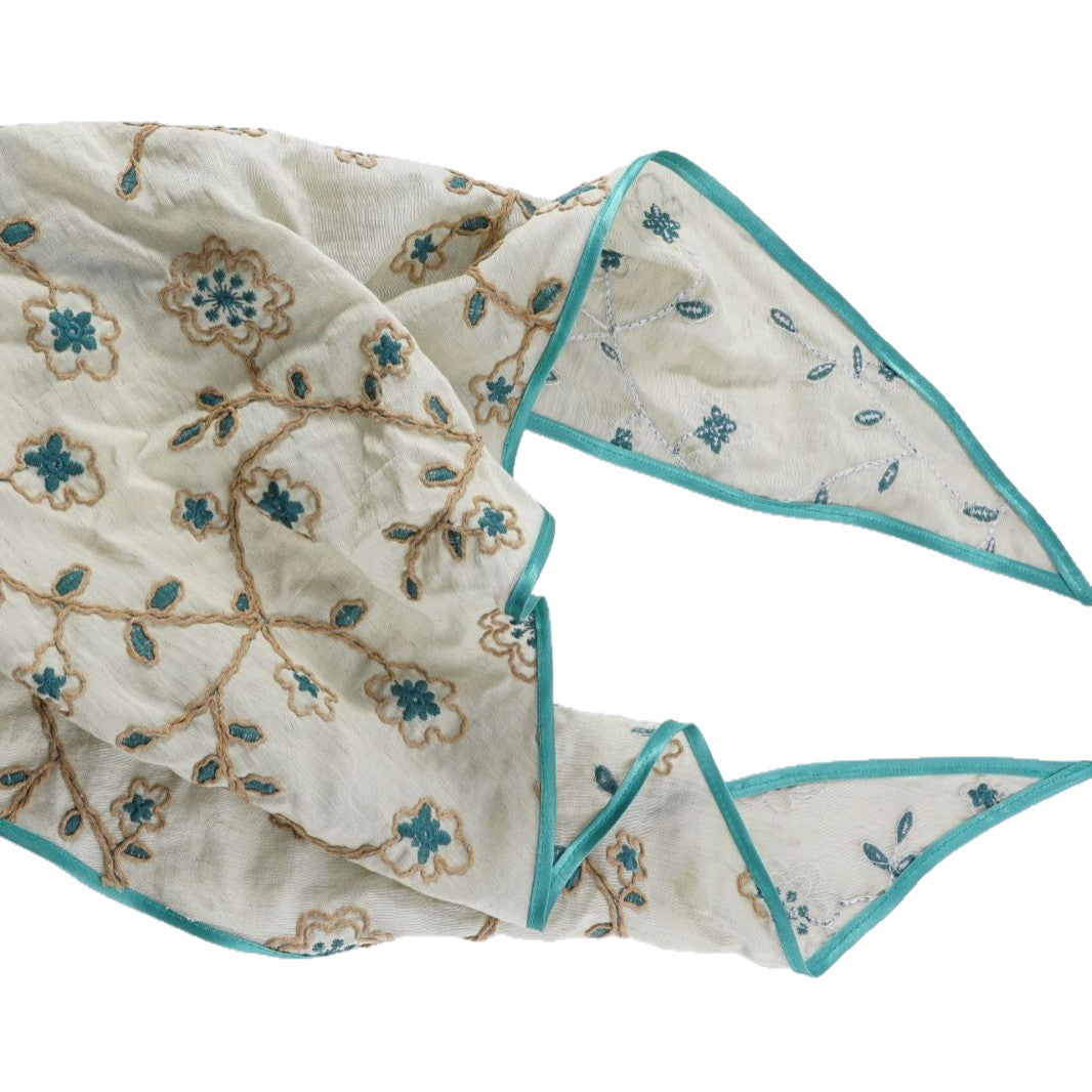 Sage triangle headscarf with teal floral vines and a green satin edge