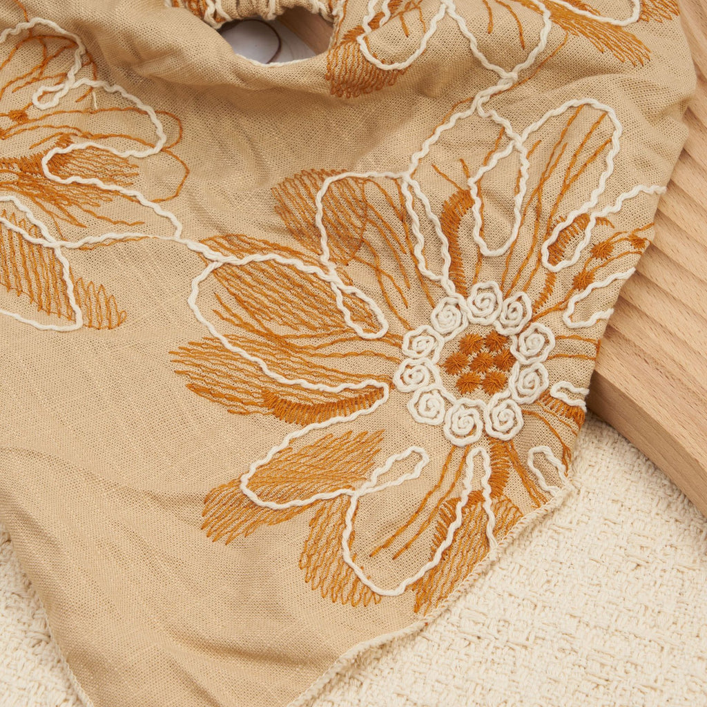 Camel triangle headscarf with rust floral embroidery and a gathered elastic back