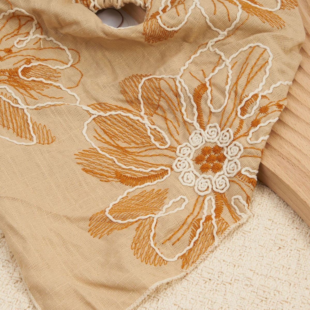 Camel triangle headscarf with rust floral embroidery and a gathered elastic back