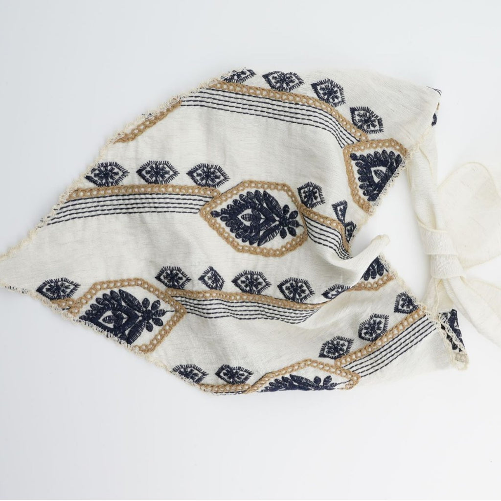 Ivory triangle headscarf with navy geometric embroidery and fabric ties