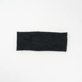 Wide knit headbands with a raised paisley pattern in ivory, coffee, and black